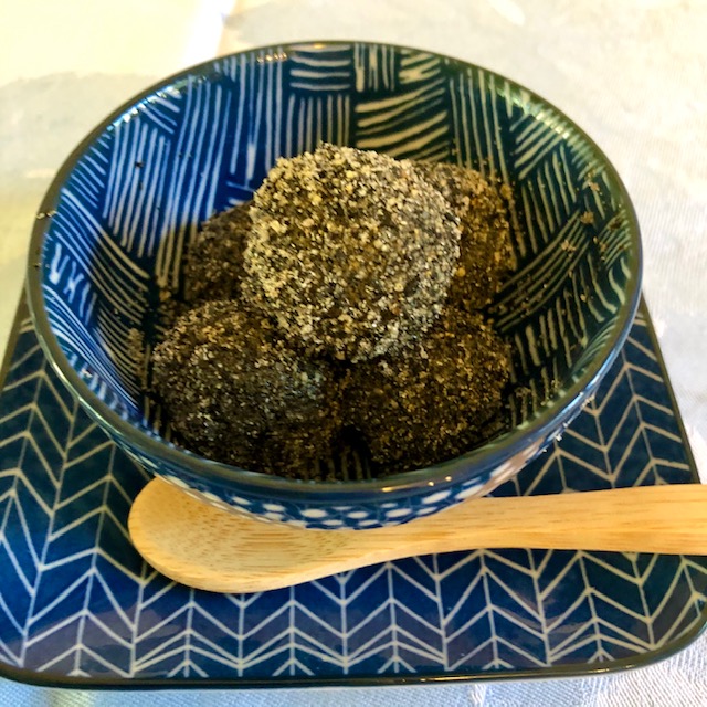 Japanese soup with mochi dumplings - dessert with sesame and sugar
