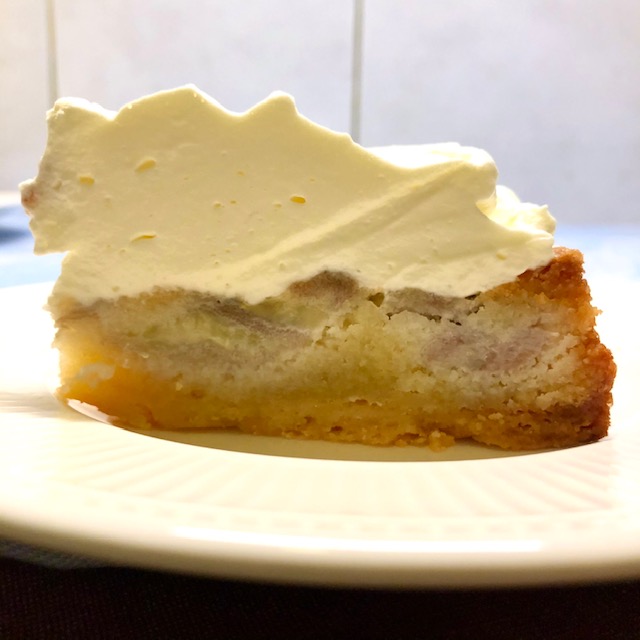 Banana tart with almond cream and whipped cream - cross section photo
