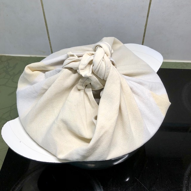 Soy sauce steamed cake - wrap a lid of a pot with cloth