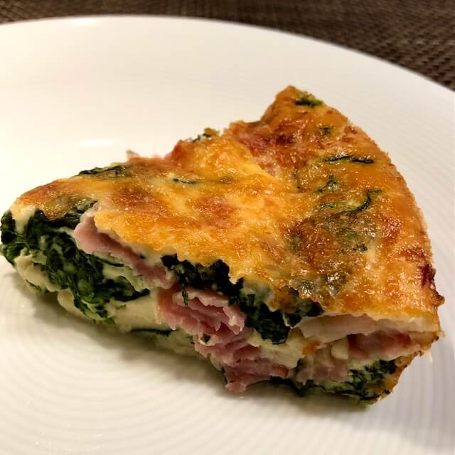 Crustless ham and spinach quiche - a slice of crustless ham and spinach quiche